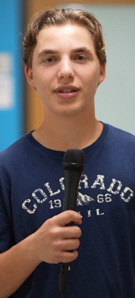 Student holding microphone